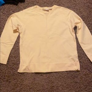 A women’s yellow sweater